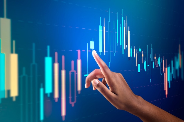 Stock market chart on virtual screen with woman's hand digital remix Free Photo