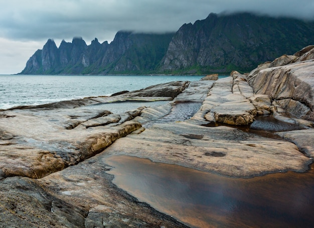 Premium Photo | Stony beach with tidal baths at ersfjord, senja, norway ...