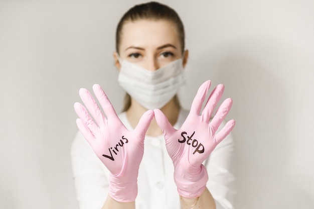 Premium Photo Stop Virus Written In Pink Gloves Of A Nurse