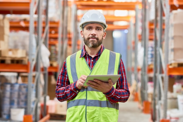 Premium Photo | Storage worker using digital tablet