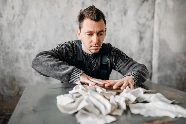 Premium Photo | Strange freak man rips the sheets from book