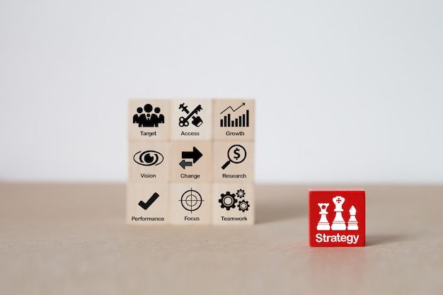 Strategy icons on wooden block for business  growth . Premium Photo
