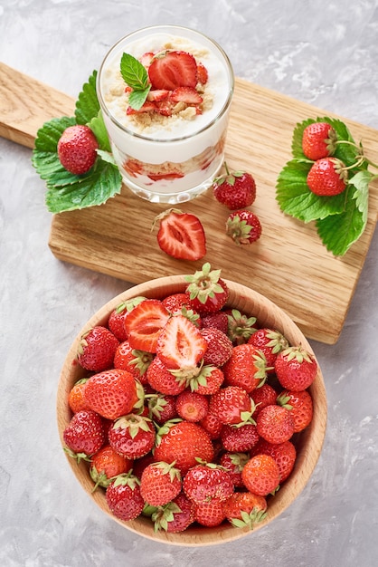 Premium Photo Strawberry Granola Or Smoothie In A Glass And Fresh