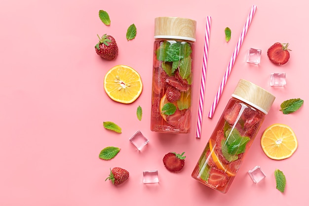 Strawberry infused water, summer iced drink with ...