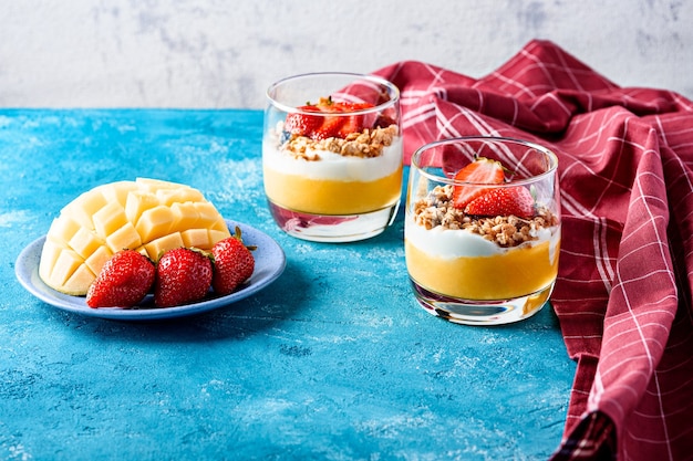Premium Photo | Strawberry mango dessert with ricotta cheese and granola