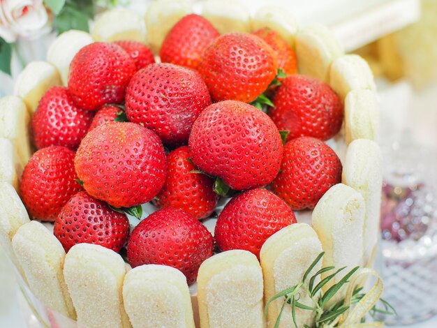 Premium Photo Strawberry Mousse Charlotte Cake Strawberry Vanilla Cake Decorate With Lady Fingers Biscuit