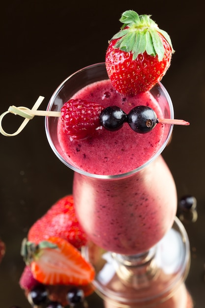 Premium Photo | Strawberry smoothie on dark background