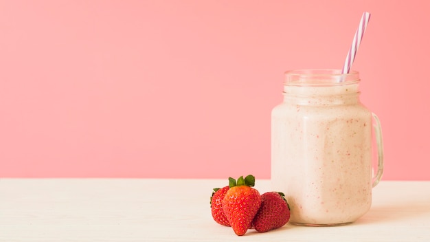 Strawberry smoothie on table top Free Photo