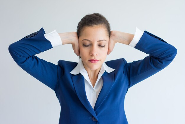 Free Photo | Stressed Business Woman Covering Ears With Hands And ...