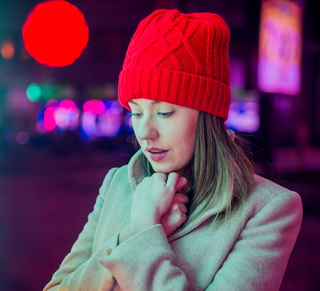 Stressed young woman in front of christmas tree. festive brunette feeling sad at christmas . tired and lonely for christmas Free Photo