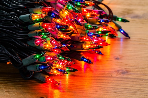 Premium Photo | String of multicolor christmas lights with green wiring.