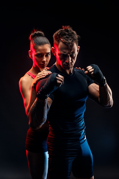 Premium Photo | Strong boxer in stance with handwraps on his fists with ...