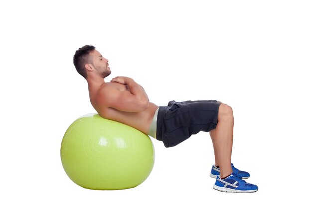 Premium Photo | Strong man practicing abdominal on a big ball