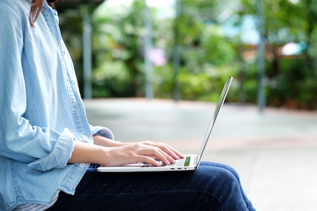 Student girl using laptop computer, online education, adult learning concept Premium Photo