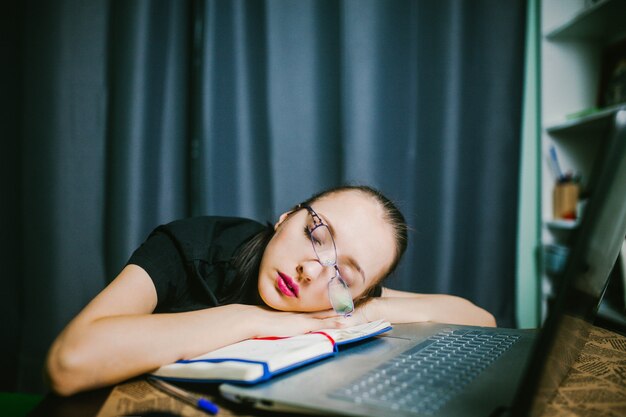 Student In Glasses Fell Asleep At Desk Premium Photo