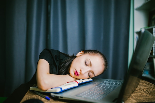 Student In Glasses Fell Asleep At Desk Premium Photo