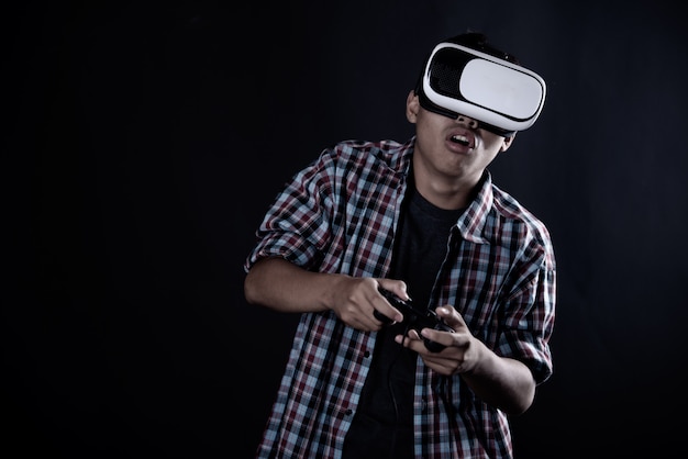 Student man wearing virtual reality goggles, vr headset. Free Photo