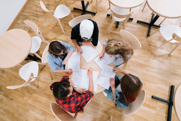 Students at table with notepads