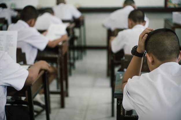 Premium Photo | Students doing test in classroom