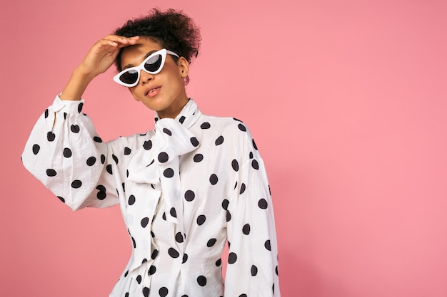 Studio photo of african black woman in stylish dress and white sunglasses Free Photo