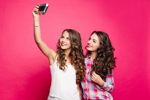 Premium Photo Studio Portrait Of Happy Nice Girls In Retro Style With Long Wavy Hair