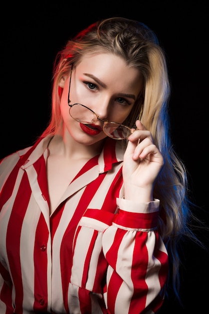 Premium Photo | Studio shot of adorable blonde woman in glasses wearing ...