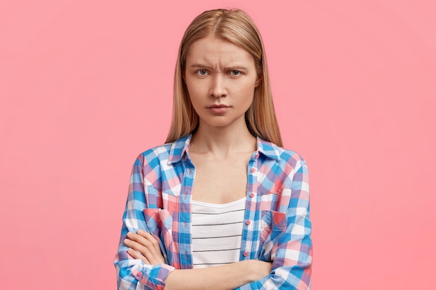 Free Photo | Studio shot of beautiful young female has sullen expression