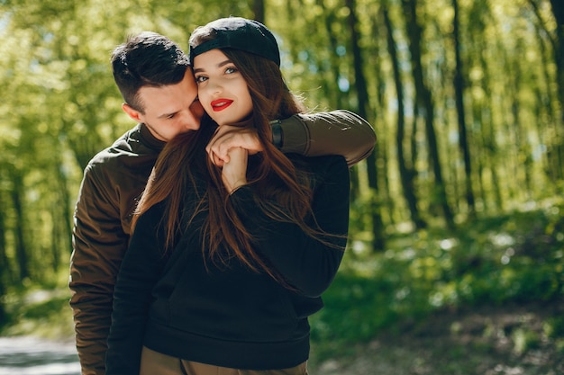 Free Photo A Stylish And Bright Love Couple Walks In The Sunny Forest Sweet love couple caring love couple love couple romants free download black love couple romantic lovely couple love jpeg love couple hand in hands. a stylish and bright love couple walks