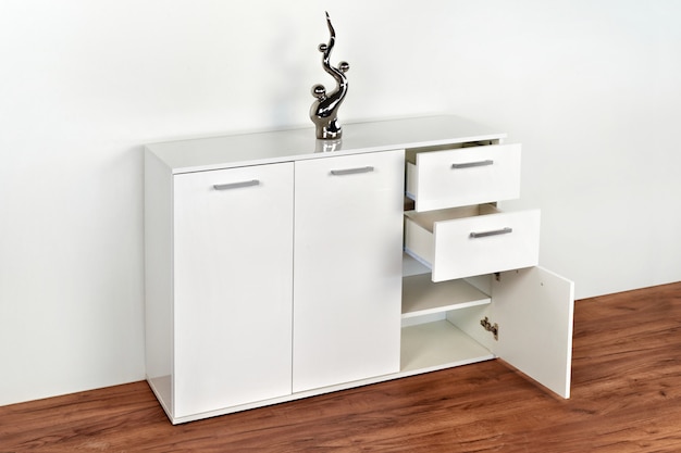 Stylish dresser on white background. furniture for ...