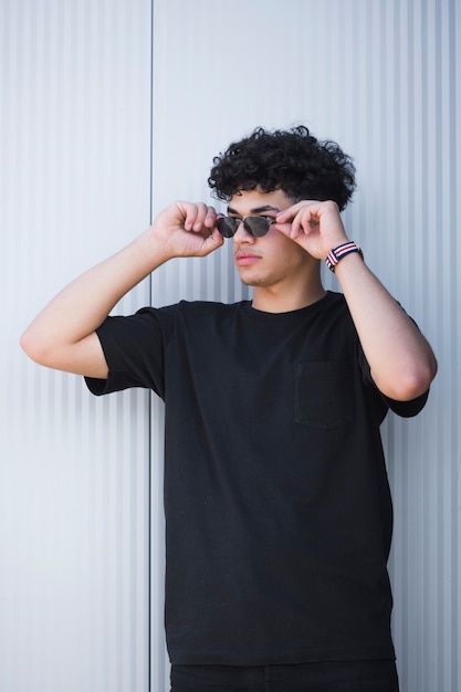 Stylish Ethnic Guy In Sunglasses With Curly Hair Photo