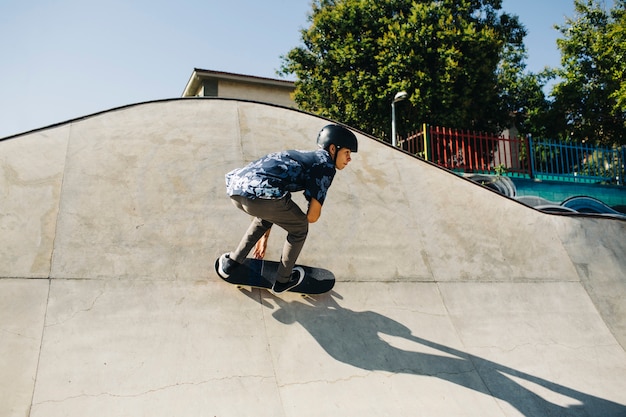 Free Photo | Stylish guy skating outdoors