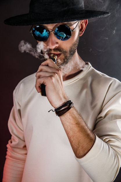 Stylish man  with vape  Premium Photo