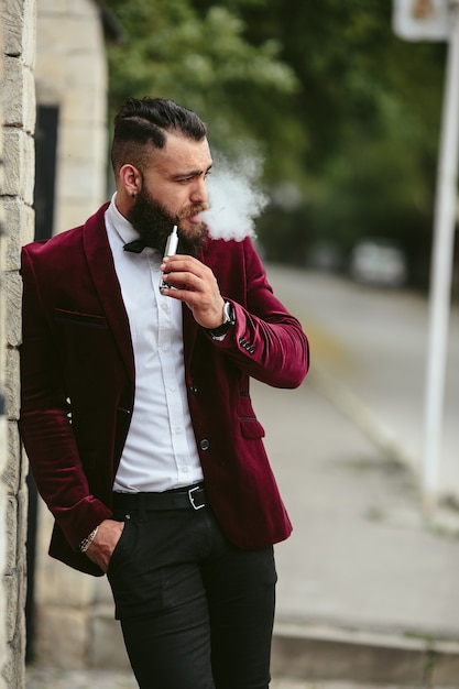 Free Photo | Stylish relaxed man smoking