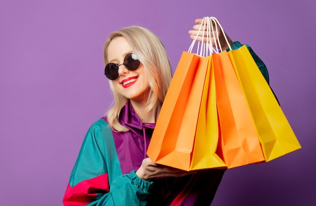 Premium Photo | Stylish woman in 80s windbreaker and roud sunglasses ...