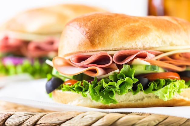 Premium Photo | Sub sandwich with fresh vegetables, lunch meat and ...