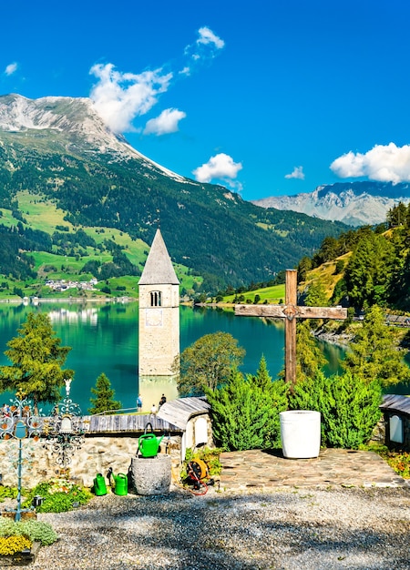 Premium Photo | Submerged Bell Tower Of Curon And A Graveyard At Graun ...