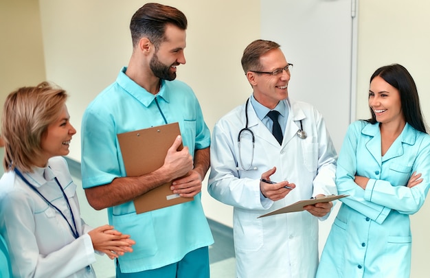 Premium Photo | A successful team of doctors with patient records ...