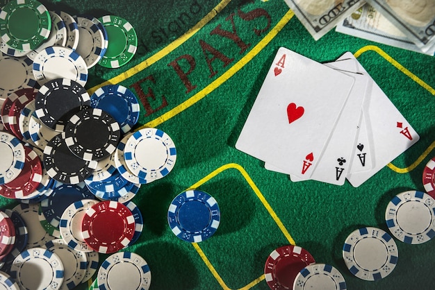 Premium Photo | Suitcase with dollars, playing card, poker chips on the ...