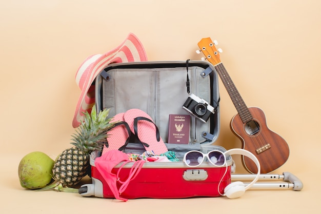 Suitcase with traveler accessories Free Photo