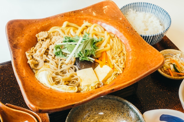 Free Photo | Suki noodles in hot plate with rice