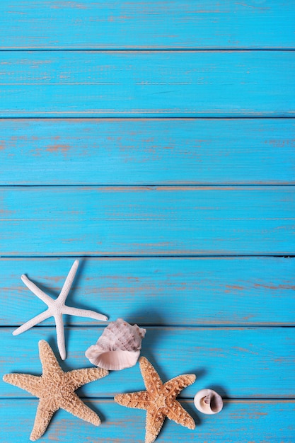 Premium Photo | Summer beach seashore background starfish blue old wood ...