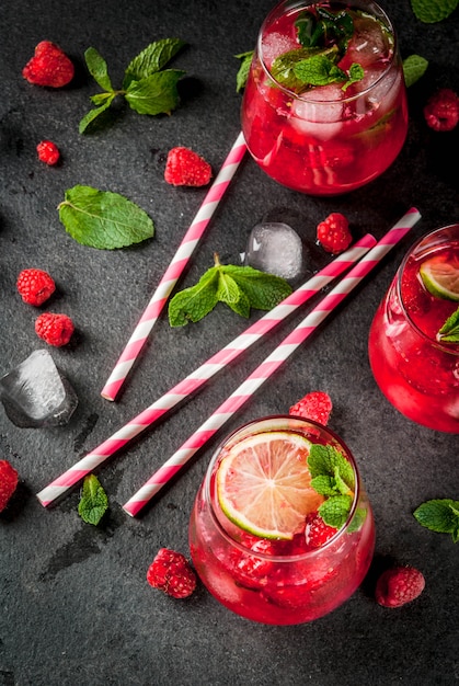 Premium Photo Summer Refreshing Non Alcoholic Cocktails Fruit Drinks Raspberry Mojito Lemonade With Fresh Organic Mint And Lime