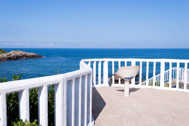 Premium Photo | Summer white beach chair with blue sky background