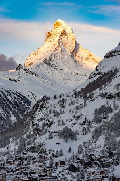 Premium Photo | The sun shines on the tip of the matterhorn in the ...