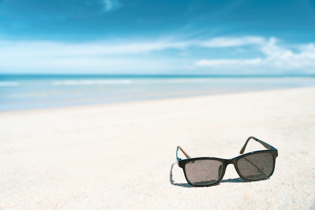 Premium Photo Sunglass On White Sand Beach With Turquoise Colour Sea