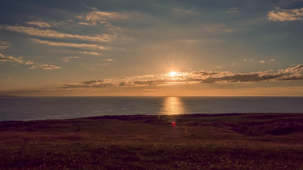 Premium Photo | Sunrise from the mountain with the ocean and the sun in ...