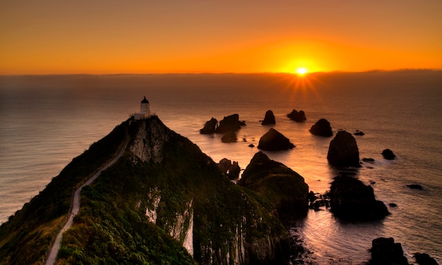 Sunset at nugget point, new zealand south island Free Photo