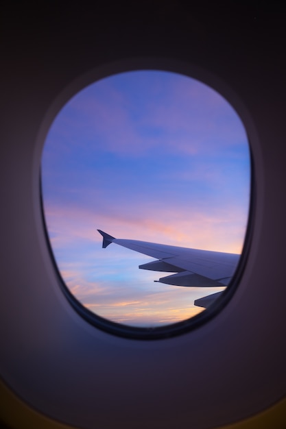 Premium Photo | Sunset sky from the airplane window