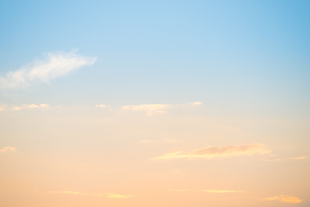 Premium Photo | Sunset with sun and clouds on blue and orange pastel sky