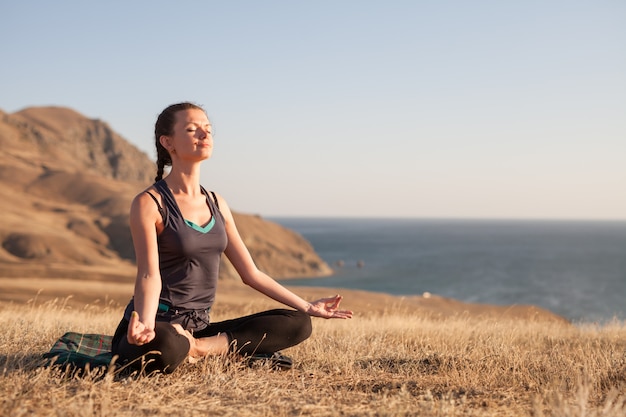 Premium Photo | Sunset yoga classes.